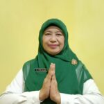 Hj. Iris Juita Kastianti, SKM,M.MKes Kepala Dinas